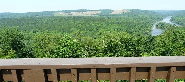 Roadside overlook at Sprewell Bluff Park near Thomaston, Georgia, provides a view of the free-flowing Flint River in soft background.