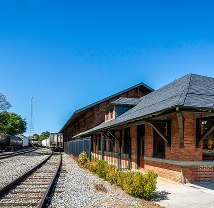 Carrollton, Georgia, USA-Oct. 20, 2022: The Old Depot on Bradley St. (formerly Carrollton Train Depot) was built circa 1888 and played a key role in the area's textile industry, now a banquet hall. Cheap car insurance in Georgia.