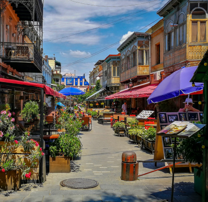 The vibrant Shardeni Street, a popular destination in Tbilisi's Old Town, characterized by its lively atmosphere, colorful parasols, and an array of cafes, boutiques near to Conyers, GA.