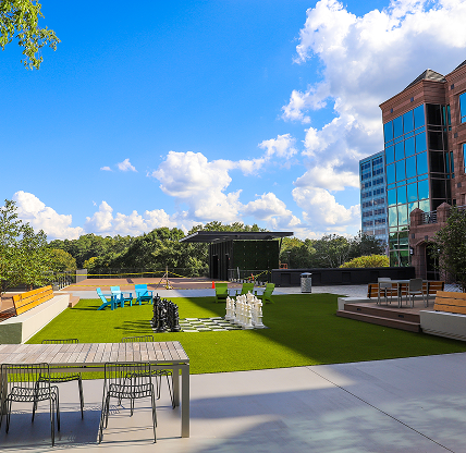 Park surrounded by lush green trees and buildings at Lenox Park in Brookhaven Georgia USA - Cheap car insurance in Brookhaven, Georgia