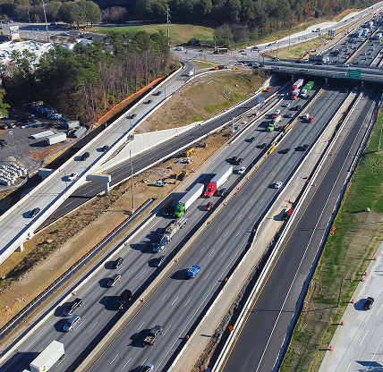 Busy traffic along Highway I-285 (the Perimeter) with under construction service road, bypass near Ashford Dunwoody in midtown - Cheap car insurance in Dunwoody, Georgia
